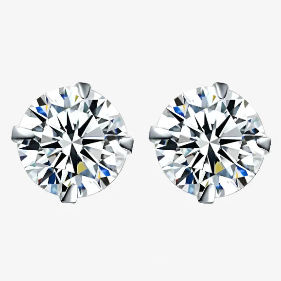 Pair of diamond stud earrings on a white background