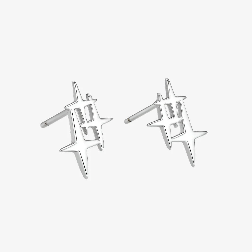 Pair of silver star-shaped earrings on a white background