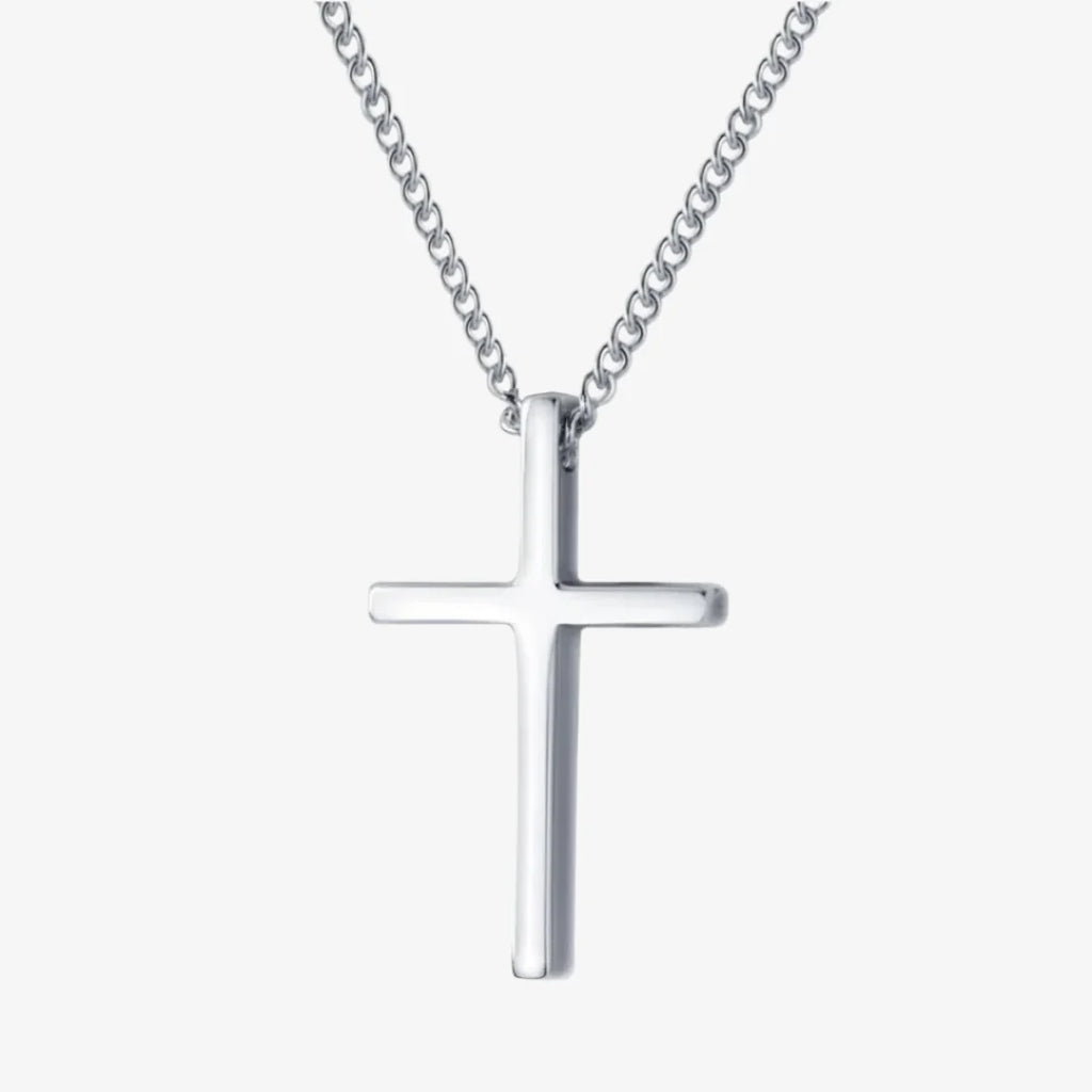 Silver cross necklace on a white background