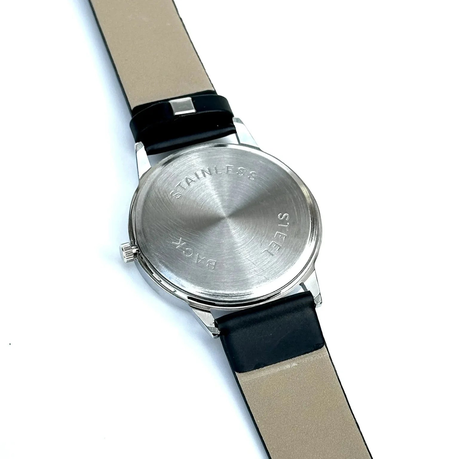 Wristwatch with black strap and silver case on a white background